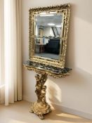 A contemporary gilt composition serpentine front console table surmounted by two cherubs,