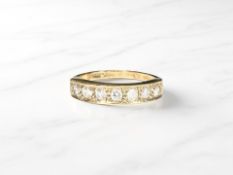 A 9ct gold half-eternity dress ring, size P CONDITION REPORT: 2.