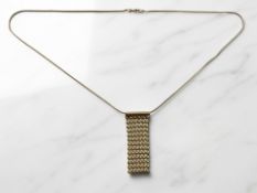 A 9ct gold necklace with 'mesh' pendant, chain length 42cm. CONDITION REPORT: 4.