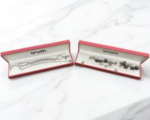 Three charm bracelets with charms