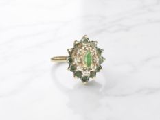 A 9ct gold emerald and diamond cluster ring, size R. CONDITION REPORT: 2.