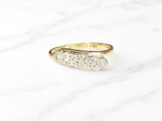 An 18ct gold five stone illusion-set diamond ring, size M. CONDITION REPORT: 2.