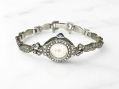 A lady's silver watch set with marcasite.