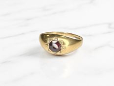 A 9ct gold gypsy-set garnet ring, size P½. CONDITION REPORT: 2.