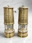 Two Ashington Colliery brass miner's safety lamps.
