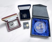 A group of Philatelic Society items to include an ingot stamped 'Germania Posta XVII 2009 Silver',