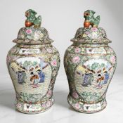 A pair of 20th century Cantonese famille rose porcelain baluster jars and covers, height 49 cm.