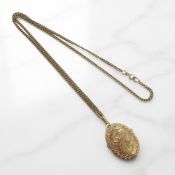 A 9ct gold locket on chain CONDITION REPORT: 8.