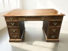 A late Victorian mahogany nine drawer twin pedestal desk, 138 cm x 73 cm x 77 cm.