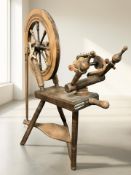 A beech spinning wheel marked 'Haldane, Made in Scotland', height 84 cm.