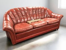 A Tetrad red leather three seater settee, length 200 cm.