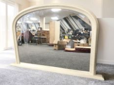 A contemporary domed overmantel mirror, 120 cm x 77 cm.