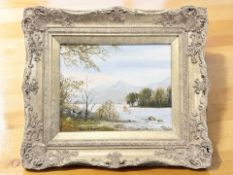Kate Holland (Contemporary) : View across a lake with mountains beyond, signed lower left,