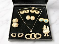 A pair of Christian Dior gold-plated circular button-shaped earrings inset with paste stones,