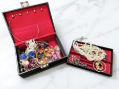 A box of costume jewellery, faux pearls, necklaces, etc.