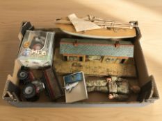 A group of collectibles including wooden pond yacht, tin plated railway station building,