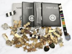 A quantity of vintage and later badges, medals, awards relating to St. John's Ambulance, etc.