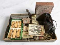 A box containing miniature wooden motor vehicles, pair of binoculars, carved wooden eastern box,