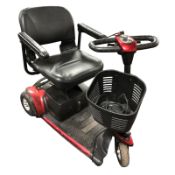 A Go Go mobility scooter with key and charging lead.