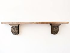 A 19th century continental carved oak wall shelf,