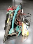 A group of garden tools including a Bosch electric strimmer, leaf blower,