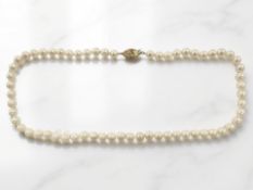 A single-strand cultured pearl necklace, the clasp stamped 750, length 44cm.