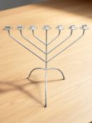 A silvered metal seven sconce candelabrum / menorah, height 83 cm.