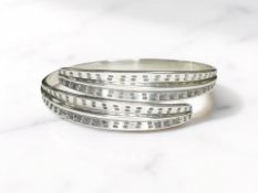 A Norwegian silver 'Saga' bangle by David Andersen, 38g.