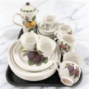 A group of Portmeirion table wares including mugs and saucers, coffee pot, dinner plates, etc.