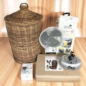A wicker laundry hamper, electric fan, radio, high pressure sprayer and other home wares.
