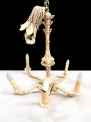 A 20th century painted composition six branch chandelier, height 73 cm.