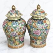 A pair of 20th century oriental temple jars and covers, height 45 cm.