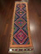 A Suzni Kilim runner, 179 cm x 52 cm.