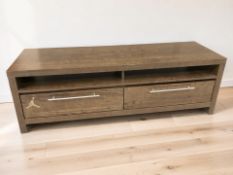 A modern wood-effect low entertainment stand, fitted drawers, 140 cm x 42 cm x 46 cm.