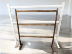 A Victorian pine towel rail and a further painted example, width 107 cm.