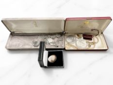 A group of silver and white metal jewellery, cameo brooch, two Churchill crowns, costume pearls,