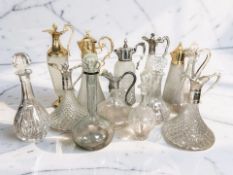 A collection of pressed glass claret jugs.