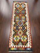 A Chobi Kilim runner, 195 cm x 62 cm.