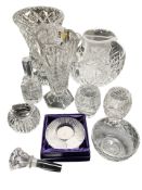 A group of crystal vases, candle holders, a table lighter, etc.