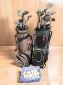 Two golf bags containing assorted irons and drivers including Hippo, Wilson, etc,