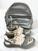 A pair of Burberry trainers, size 43, and a Valentino backpack.
