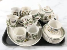 A group of Portmeirion table wares including mugs and saucers, tea pot, dinner plates, etc.