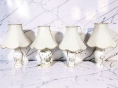 Four Aynsley porcelain lamp bases with shades, height 54 cm.