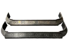 A pair of 19th century steel fire curbs, overall length 118 cm.