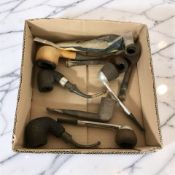 A small group of antique pipes.