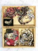 A modern jewellery box of assorted costume jewellery, simulated pearls, etc.