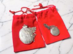 Two silver lockets on chains. CONDITION REPORT: 21.7g gross.