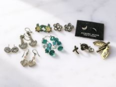 Seven pair of silver earrings including an enamelled maple leaf pair,