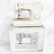 A John Lewis electric sewing machine in box, and a further Singer sewing machine.