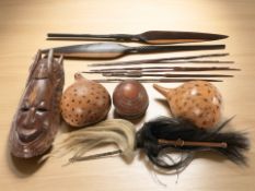 A group of carvings, African mask,